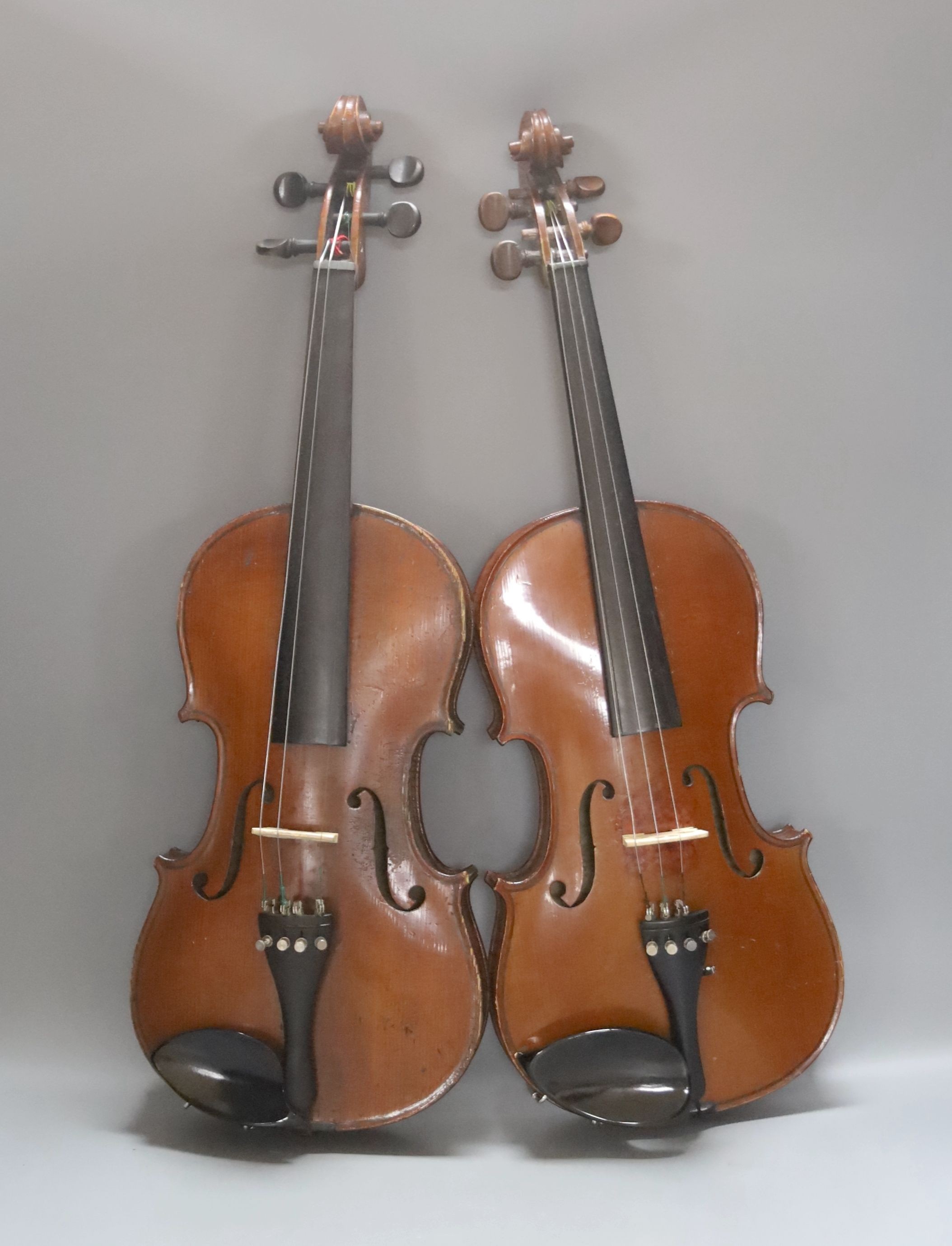 An early 20th century French vioilin, cased with bow and a cased saxon violin